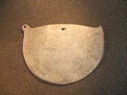 Cosmetic palette, with bore-hole, Nagada II.  © Manchester Museum. 